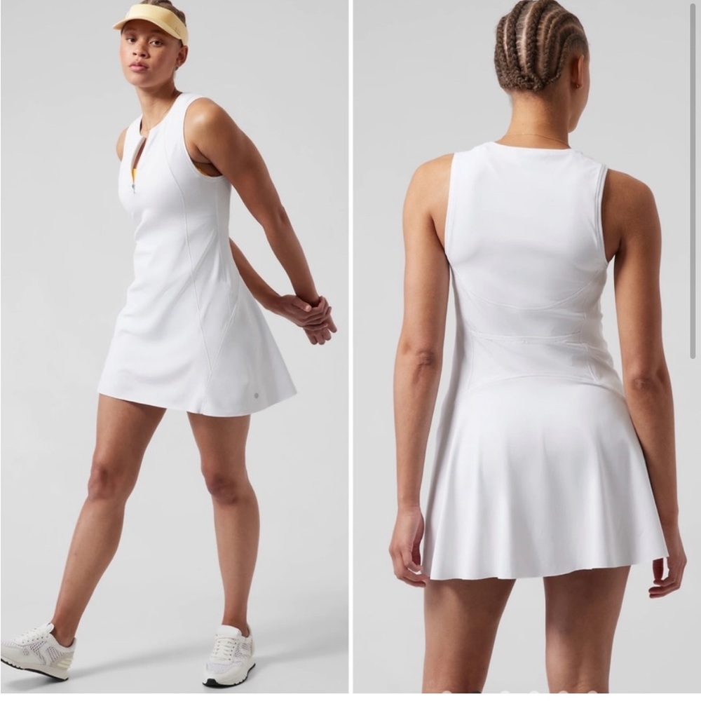 Athleta ace tennis dress in white flare with pockets.short